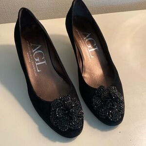 Dressy black suede AGL pump with beaded flower detail. Size 8. 2” heel.
